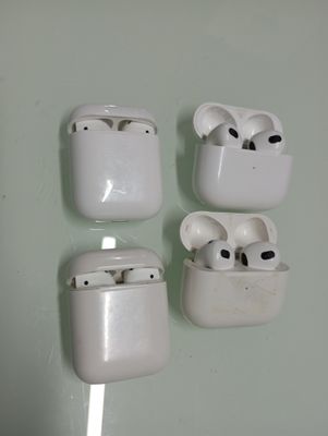 four airpods that are attached to a wall