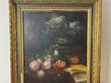 a picture of a painting on a easel with a painting of fruit and vegetables on it
