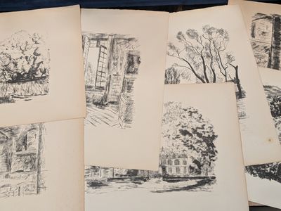 several drawings of a house and trees are shown on a table