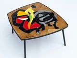 a small table with a mosaic design on it