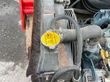 a small engine in the back of a truck