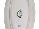 a white plate with a green design on it