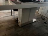 a desk with a computer and a keyboard on it