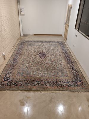 a large rug on the floor in a room