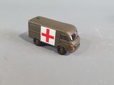 a toy ambulance truck with a red cross on it