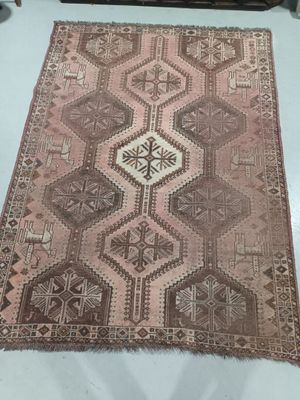 a brown and white rug on a white table
