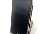 a cell phone that is sitting on top of a stand