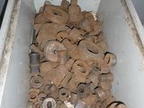 a white box filled with lots of wooden pieces