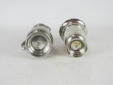 pair of silver plated brass plated knobs on a white surface