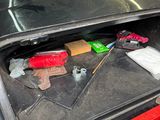 a trunk of a car with tools inside of it