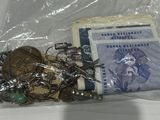 a lot of coins and other items in a plastic bag