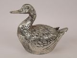 silver plated duck shaped trinket on a white background