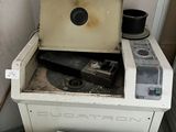 two old stoves and a trash can in a room