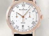 a close up of a watch with roman numerals on it