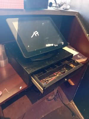 a computer sitting on top of a desk in a room
