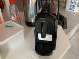 a coffee maker on the counter in the kitchen