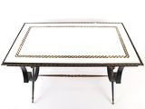 a black and white coffee table with a gold border around the top