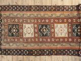 a close up of a rug on a wooden floor on a wooden floor