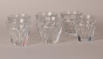 four glasses sitting next to each other on a table