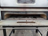 a metal oven with a metal tray inside of it