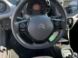 a steering wheel and dashboard of a small car