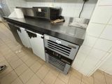 an image of a kitchen with a microwave and a refrigerator