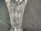 a glass vase that is sitting on a table