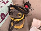 a vacuum that is sitting on the floor next to a box