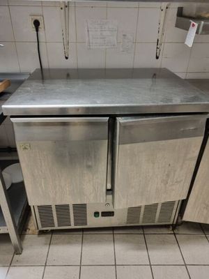 a stainless steel counter top in a commercial kitchen