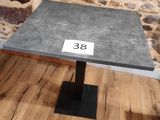 a table with a number on it in front of a stone wall
