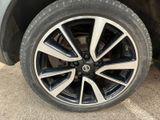 a close up view of a tire on a car