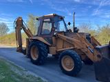 a tractor that is parked on the side of the road