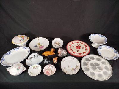 many different types of plates and bowls on the table
