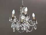 an image of a crystal chandelier hanging from a ceiling