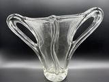 a glass vase that is sitting on a table