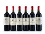 six bottles of wine lined up in a row on a white surface