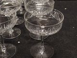 a lot of glasses that are sitting on a table