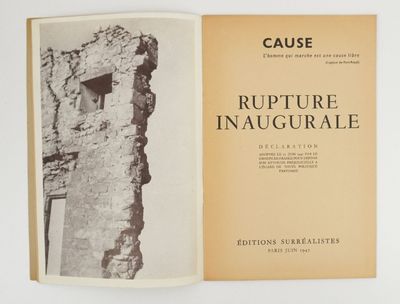 an open book with a black and white photo of an old building