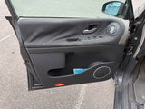 a car door open with the driver ' s side door open
