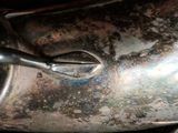 a close up view of a silver teapot on a table