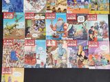 a lot of comic books on the table