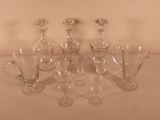 a lot of glass items that are sitting on a table