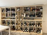 many bottles of wine on the shelves in this room