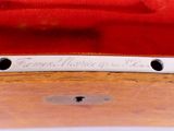 a close up of a piece of metal on a wooden table