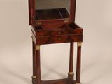an old wooden table with a mirror on top of it