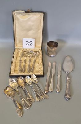 a box with silverware on a table with a number of spoons