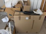 a pile of boxes with a laptop on top of it
