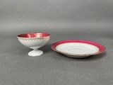 a close up of a small bowl and saucer on a table