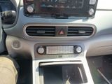 a car dashboard with a radio and a steering control