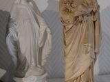 a statue of a woman and a statue of a man on a table
